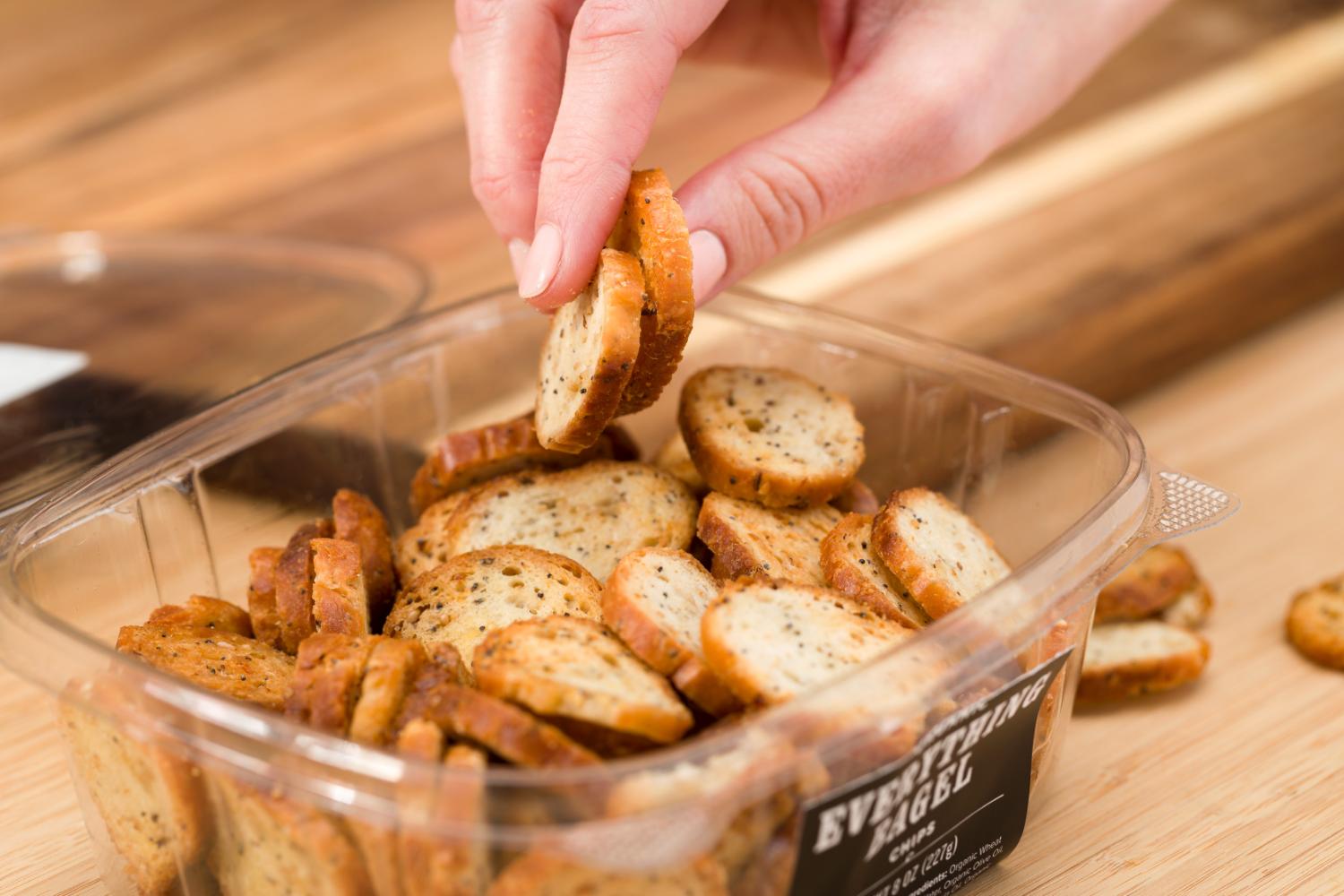 Everything Bagel Chips being grabbed out of its container