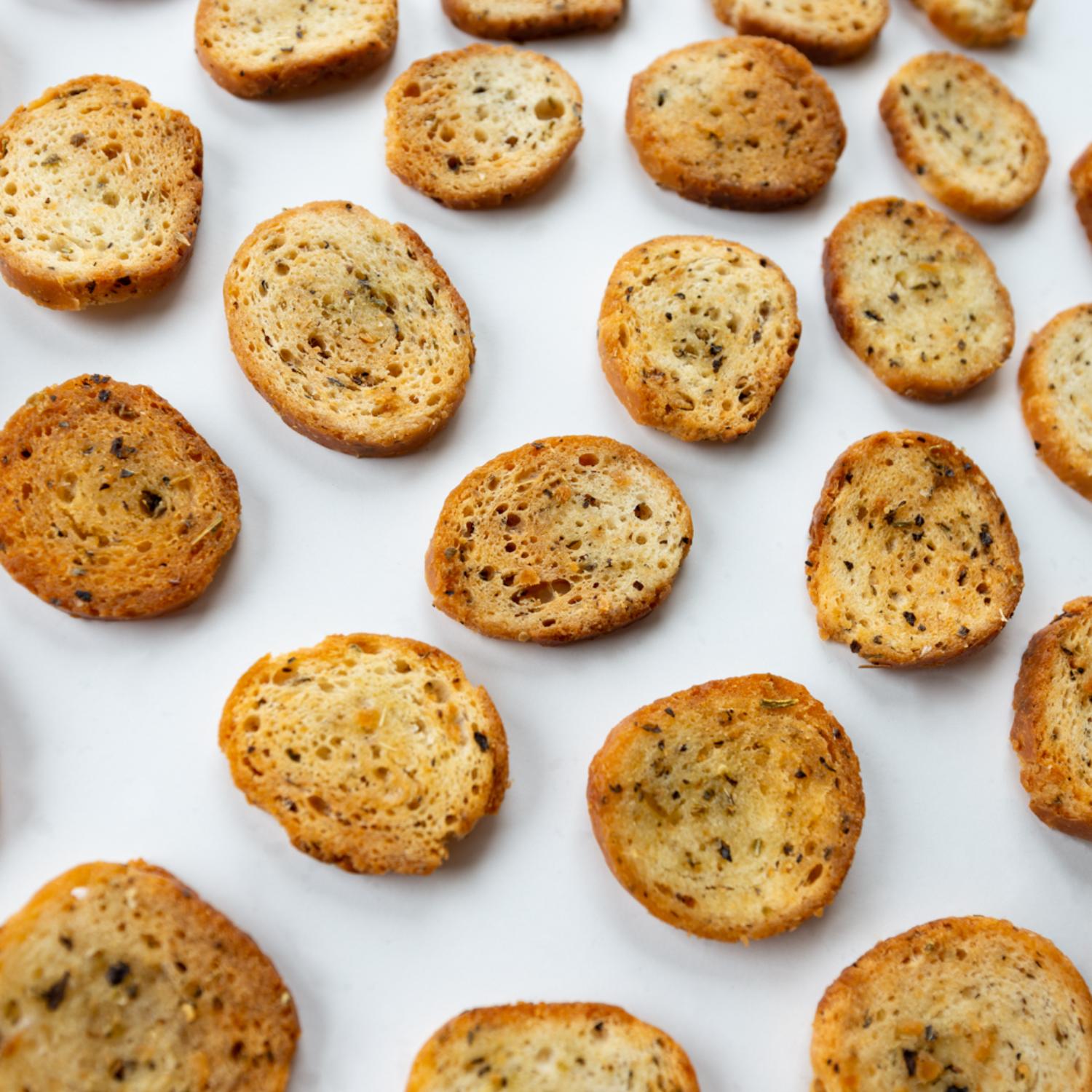 Garlic & Herb Bagel Chips spread out in single layer